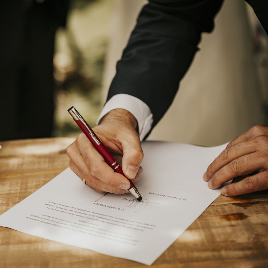 Man signing a marriage license