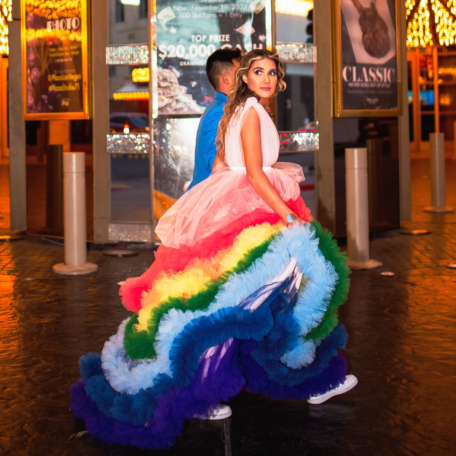 bride wearing a rainbow wedding dress on las vegas strip